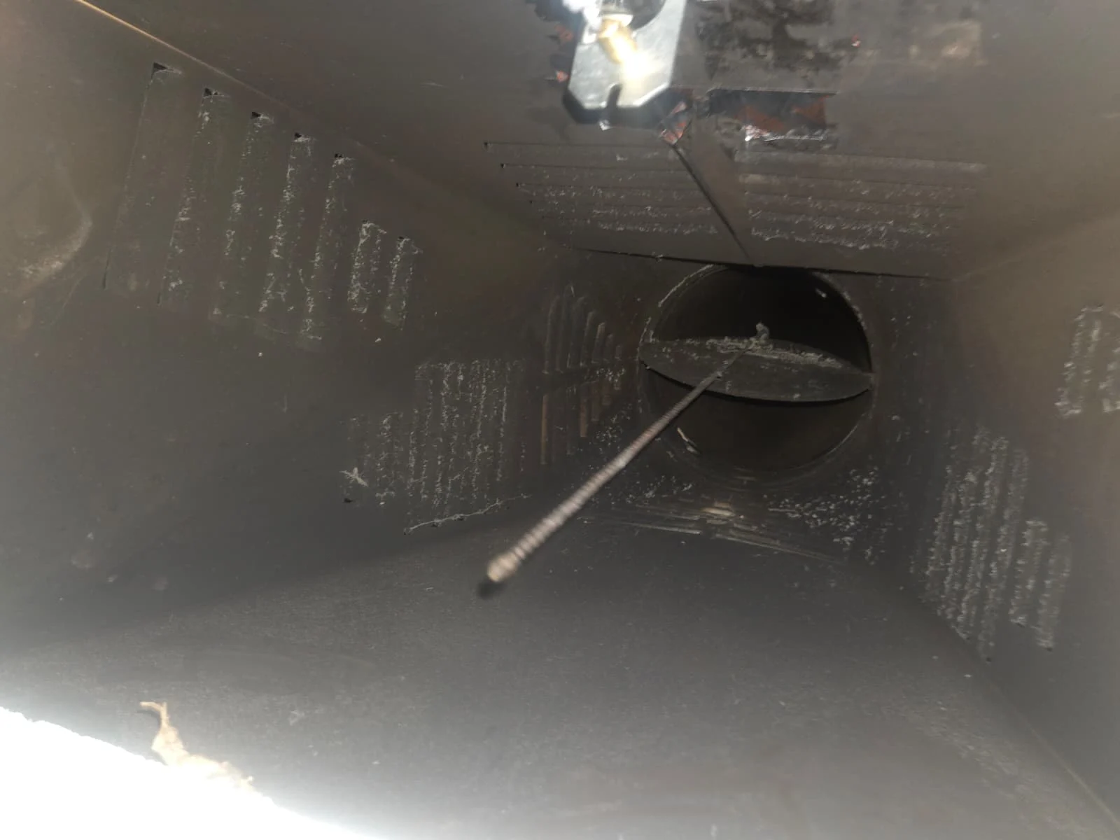 Client photograph of the matching metal damper chamber with clearer visible surfaces