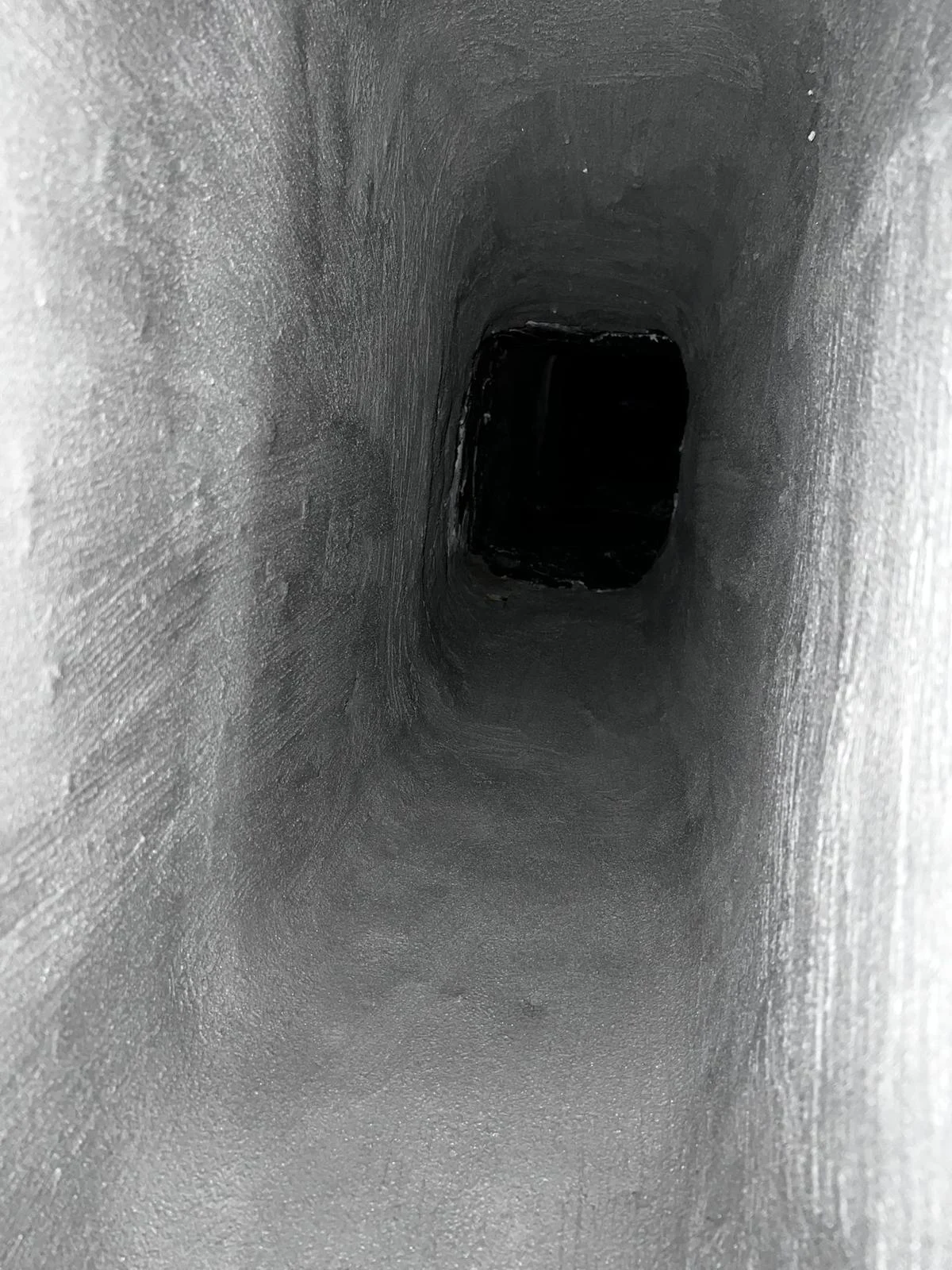 Client photograph of the matching rectangular chimney passage with a more even visible surface